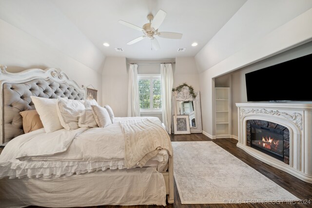 bedroom featuring ceiling fan, vaulted ceiling, and dark wood-type flooring