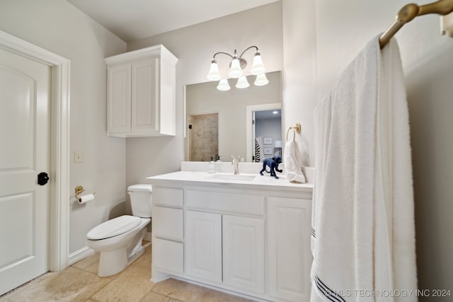 bathroom with toilet, tile patterned flooring, and vanity