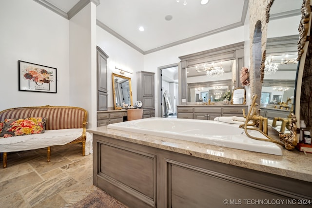 bathroom with tile patterned flooring, a notable chandelier, ornamental molding, and vanity