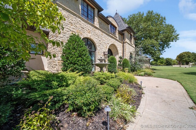 view of property exterior featuring a yard