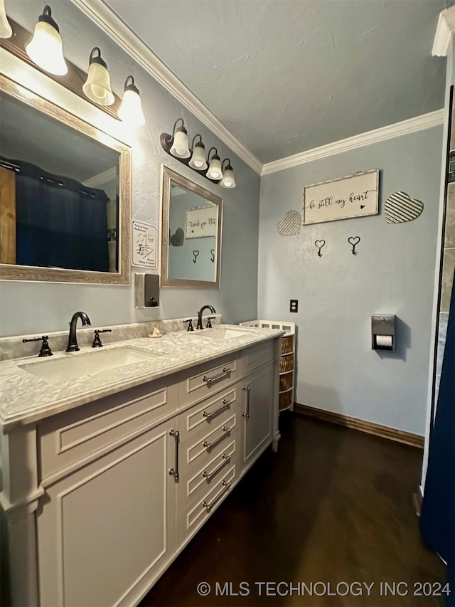 bathroom featuring crown molding and dual vanity