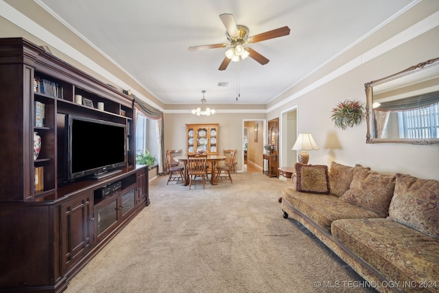 living room featuring ceiling fan with notable chandelier, ornamental molding, and carpet