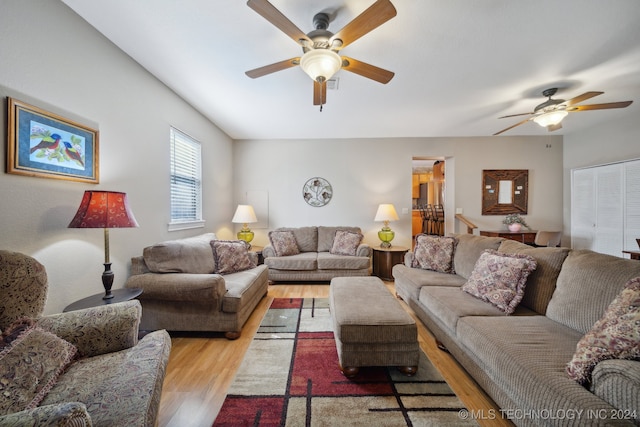 living room featuring ceiling fan and light wood-type flooring