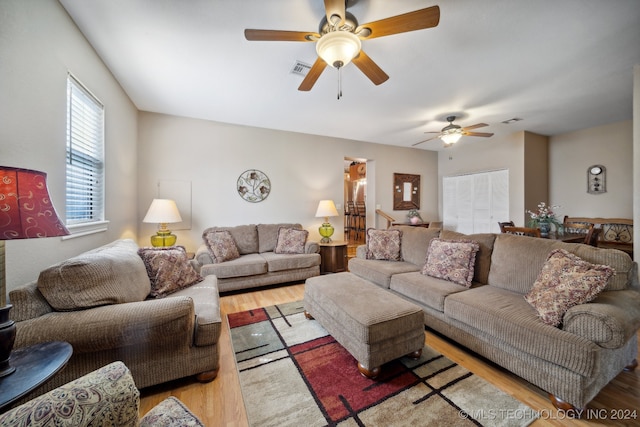 living room with ceiling fan and light hardwood / wood-style floors