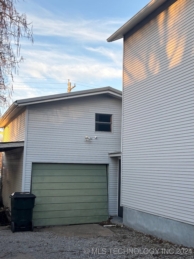 view of side of property with a garage