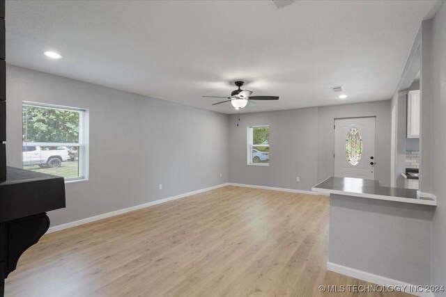 701 W Alabama, Durant, OK 74701 - unfurnished living room with recessed lighting, light wood-style floors, baseboards, and ceiling fan