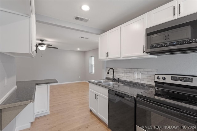 kitchen with ceiling fan, white cabinetry, appliances with stainless steel finishes, light hardwood / wood-style floors, and sink