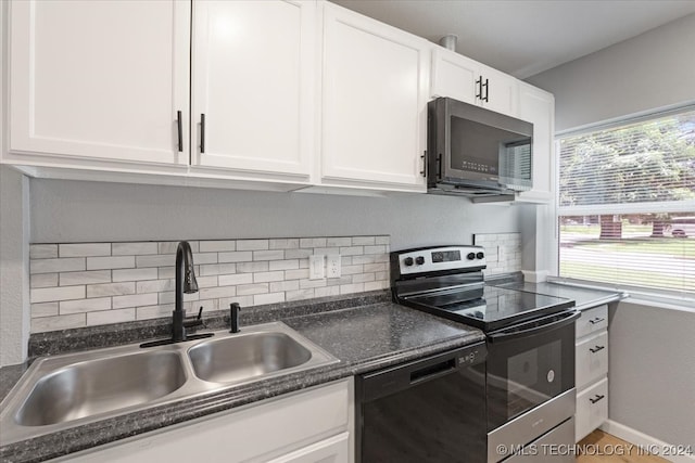 kitchen featuring white cabinetry, stainless steel appliances, and decorative backsplash