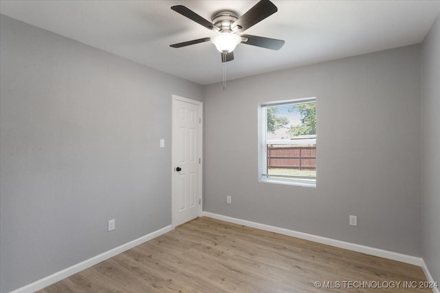 unfurnished room featuring ceiling fan and light wood-type flooring