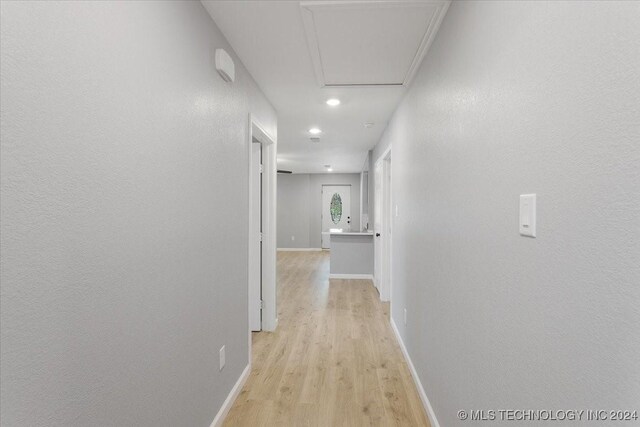 701 W Alabama, Durant, OK 74701 - hall featuring baseboards, light wood finished floors, and recessed lighting