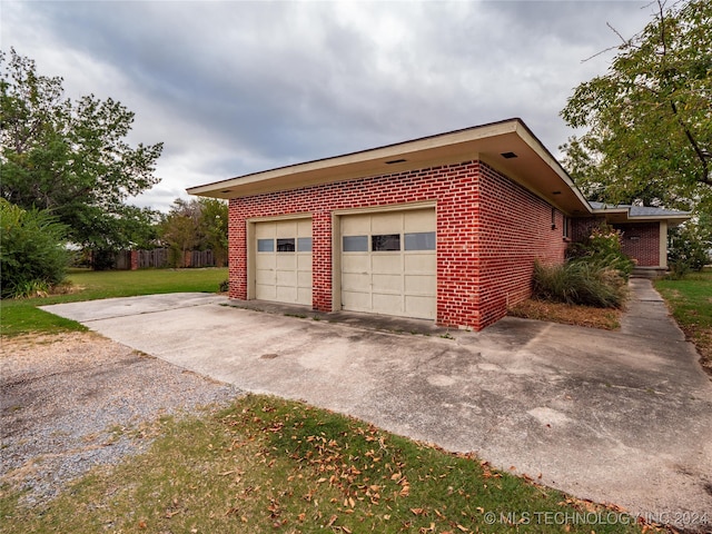 garage featuring a yard