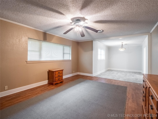 spare room with hardwood / wood-style flooring, ceiling fan, and ornamental molding