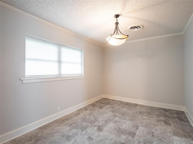 unfurnished room featuring a textured ceiling, a healthy amount of sunlight, and crown molding