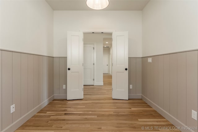 empty room with light hardwood / wood-style flooring