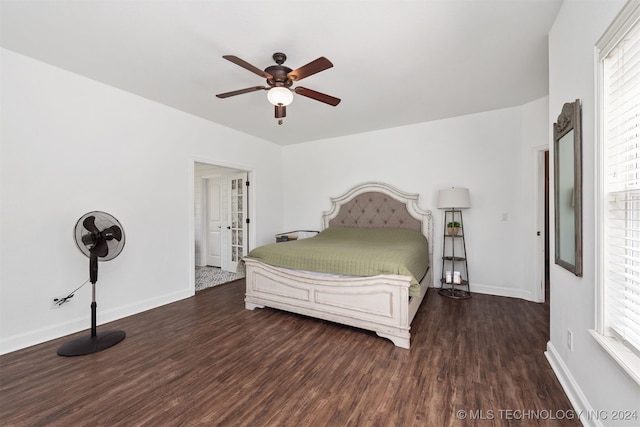 bedroom with multiple windows, ceiling fan, and dark hardwood / wood-style floors