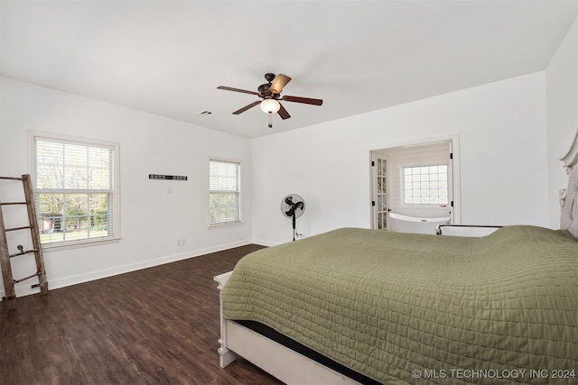 bedroom with ceiling fan and dark hardwood / wood-style floors