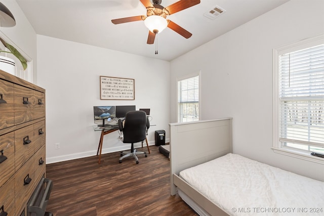 bedroom featuring ceiling fan and dark hardwood / wood-style floors