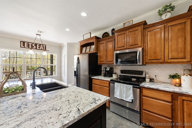 kitchen with light stone countertops, sink, hanging light fixtures, backsplash, and appliances with stainless steel finishes