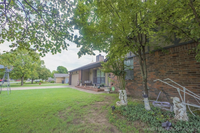 view of yard with a garage