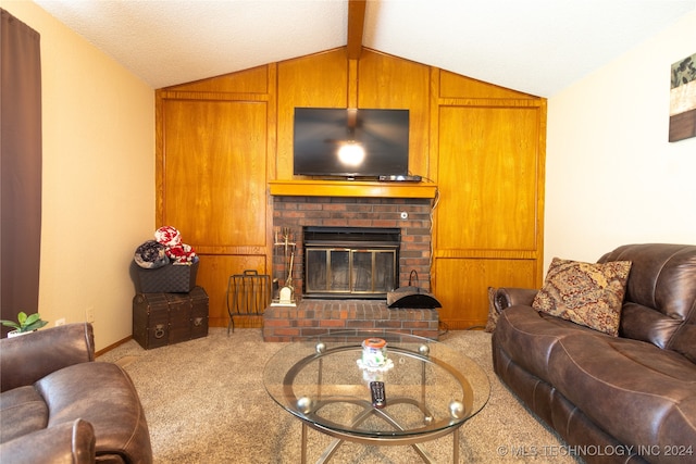 carpeted living room featuring wood walls, lofted ceiling with beams, and a brick fireplace