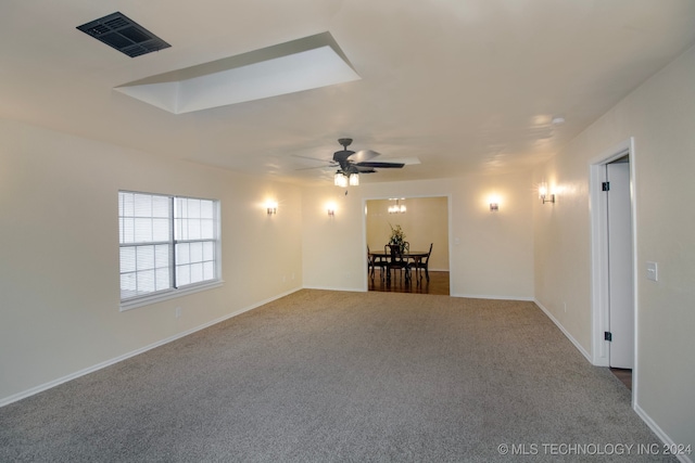 empty room with carpet flooring and ceiling fan