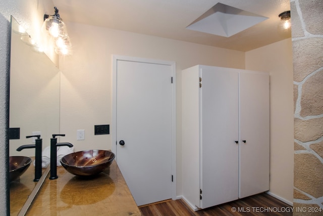 bathroom featuring vanity and hardwood / wood-style floors