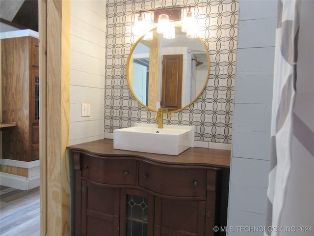 bathroom with vanity and hardwood / wood-style floors