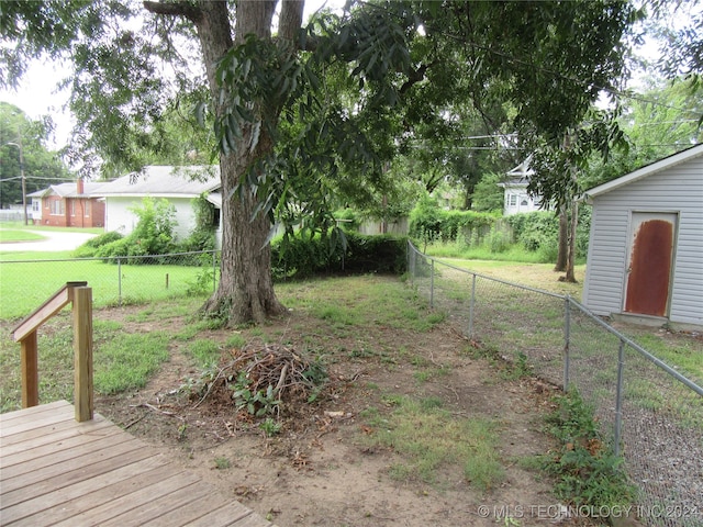 view of yard with a wooden deck