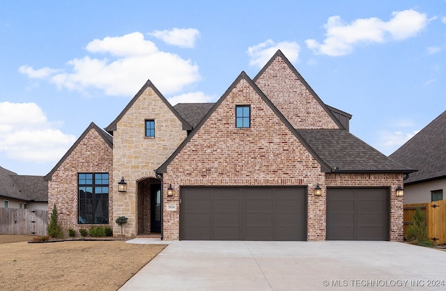 5424 E 125th Pl S, Bixby, OK 74008 - view of front of property with concrete driveway, fence, brick siding, a shingled roof, and an attached garage