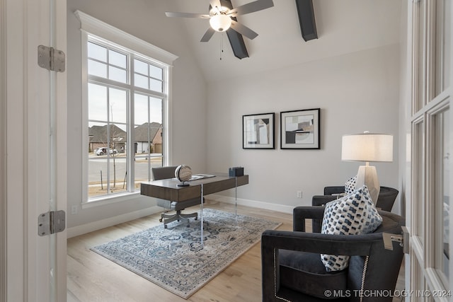 office with ceiling fan, vaulted ceiling, and light hardwood / wood-style flooring