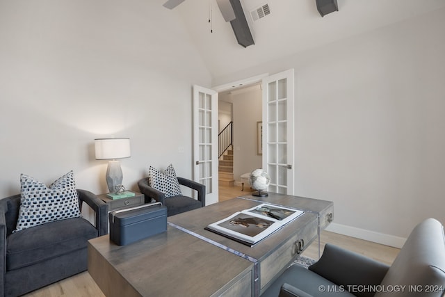 interior space featuring ceiling fan, light wood-type flooring, high vaulted ceiling, and french doors