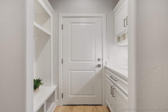 doorway with light hardwood / wood-style flooring