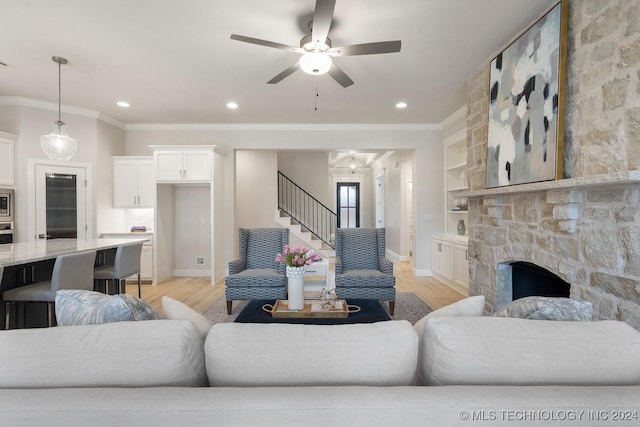 5424 E 125th Pl S, Bixby, OK 74008 - living area featuring light wood-type flooring, ornamental molding, baseboards, stairway, and recessed lighting