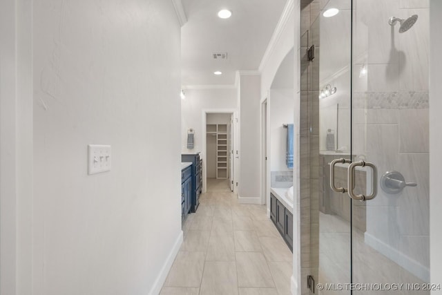 5424 E 125th Pl S, Bixby, OK 74008 - full bathroom featuring ornamental molding, a shower stall, a spacious closet, baseboards, and recessed lighting