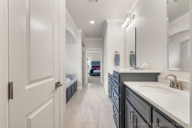 bathroom with a washtub, crown molding, double sink vanity, and tile patterned floors