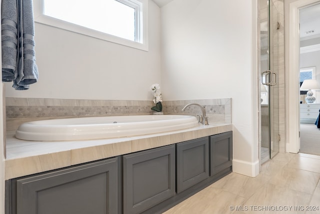 bathroom featuring independent shower and bath and tile patterned floors