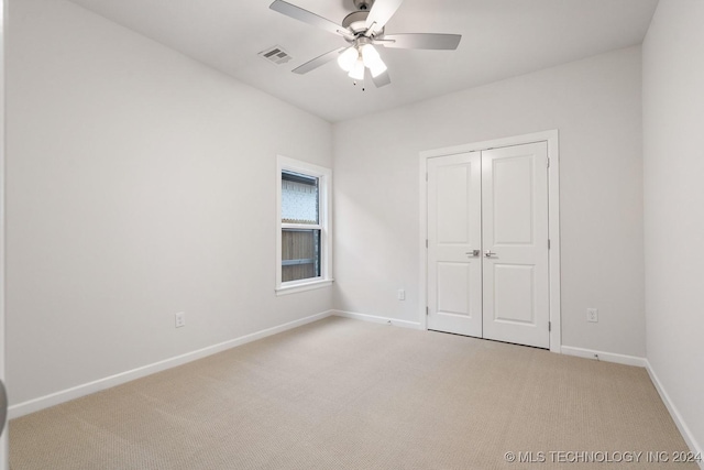 5424 E 125th Pl S, Bixby, OK 74008 - unfurnished bedroom featuring light carpet, baseboards, a closet, and a ceiling fan