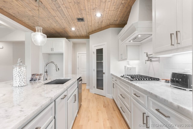 kitchen with premium range hood, light hardwood / wood-style flooring, decorative backsplash, sink, and wooden ceiling