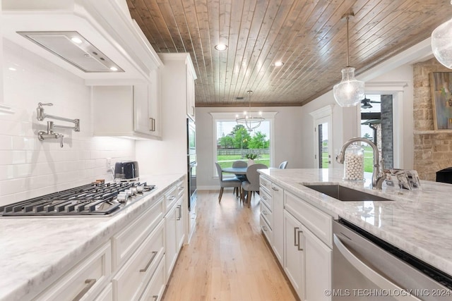 1734 W 115th Pl, Jenks, OK 74132 - kitchen with a sink, appliances with stainless steel finishes, white cabinets, wooden ceiling, and tasteful backsplash