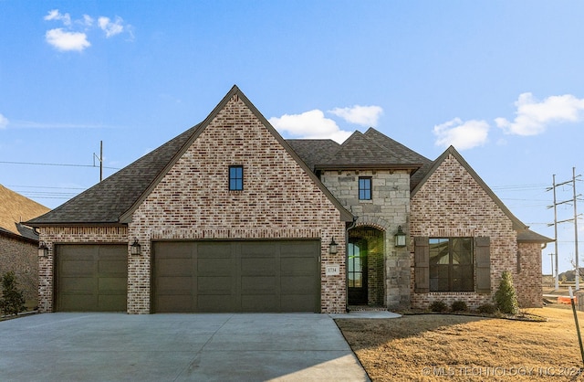 view of front of property with a garage