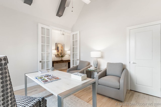 interior space with ceiling fan, high vaulted ceiling, light hardwood / wood-style flooring, and beamed ceiling