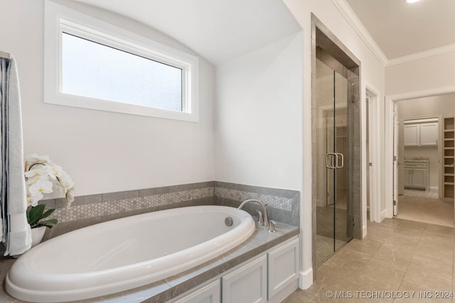 bathroom featuring tile patterned flooring, shower with separate bathtub, lofted ceiling, and ornamental molding