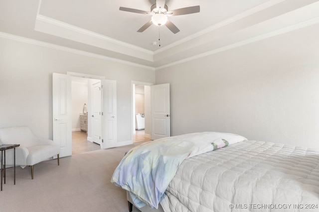 carpeted bedroom featuring ceiling fan, a raised ceiling, and ornamental molding