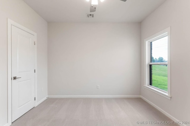 1734 W 115th Pl, Jenks, OK 74132 - empty room with light carpet, plenty of natural light, and ceiling fan