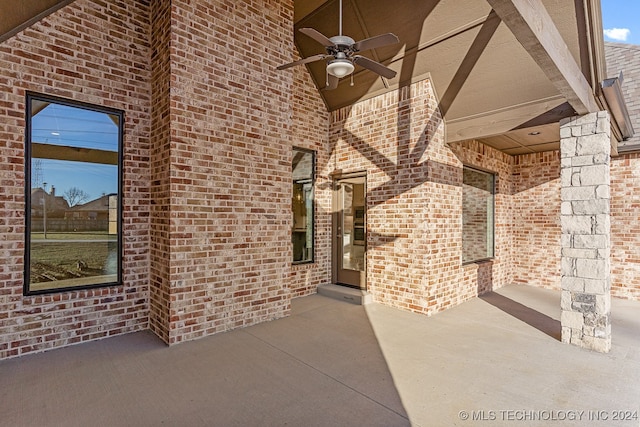 view of patio featuring ceiling fan