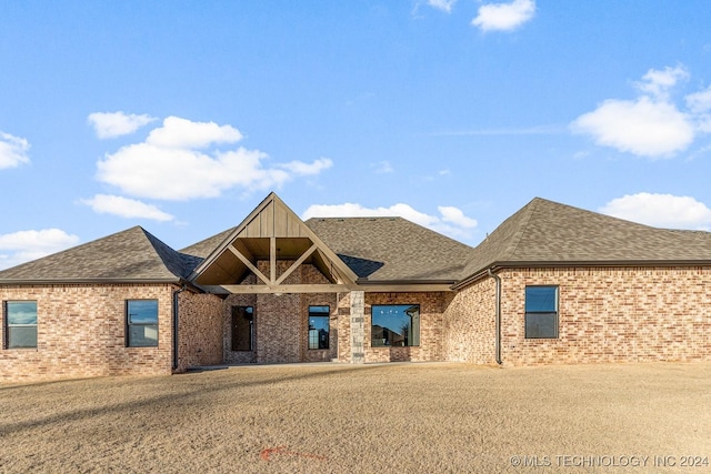 1734 W 115th Pl, Jenks, OK 74132 - view of front of property featuring roof with shingles, brick siding, and a front yard