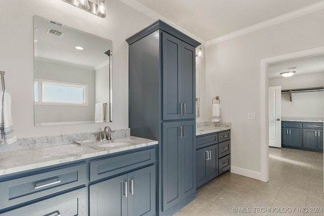 bathroom with tile patterned floors, vanity, and ornamental molding