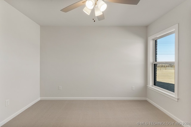 carpeted empty room with ceiling fan