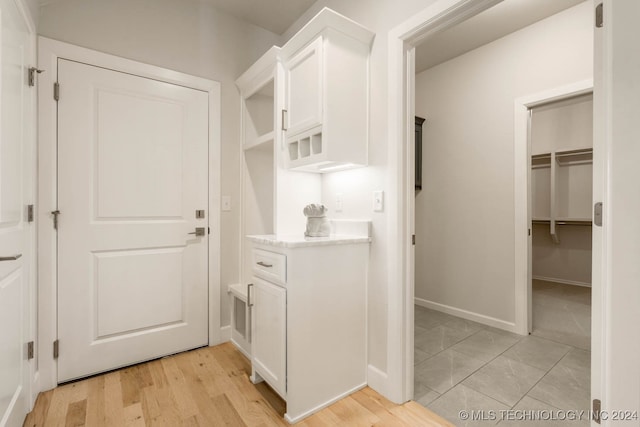 mudroom with light hardwood / wood-style flooring