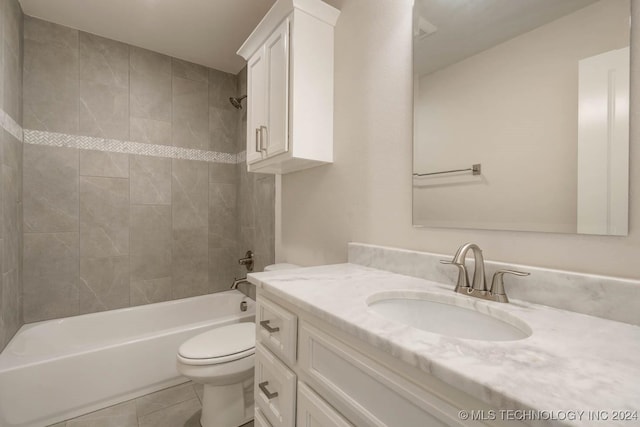 full bath featuring toilet, shower / washtub combination, vanity, and tile patterned floors